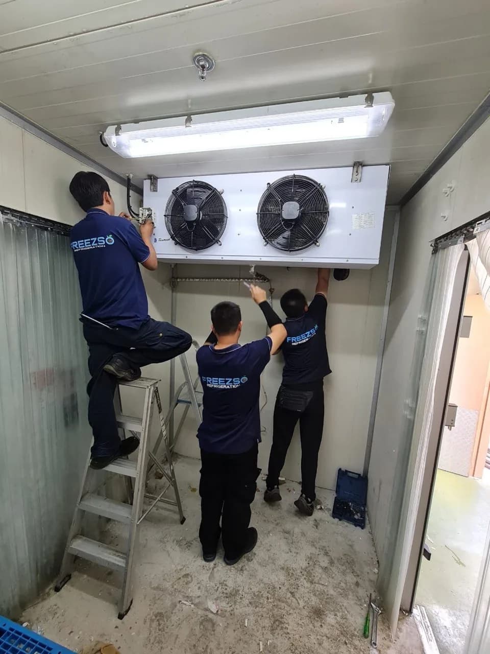 Freezso commercial refrigeration technicians servicing a cold room