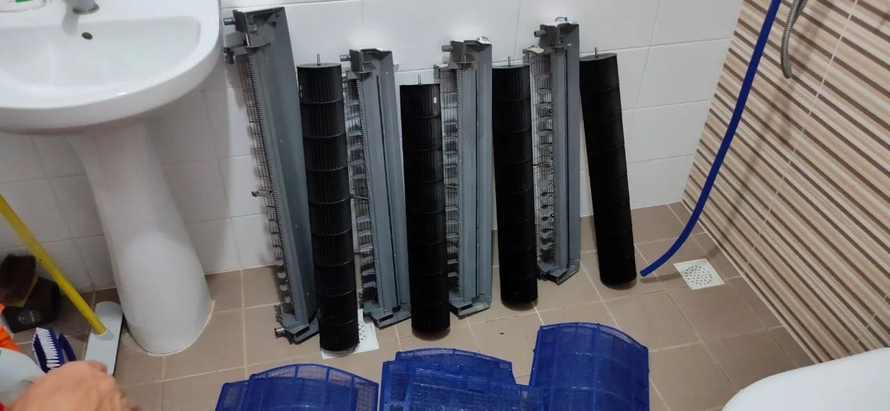 Cleaned aircon components prepared by Freezso technicians for reassembly